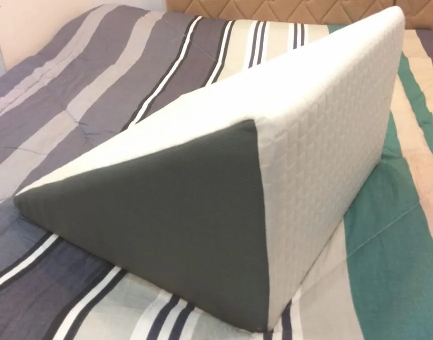 Wedge pillow with one side firm and one side soft